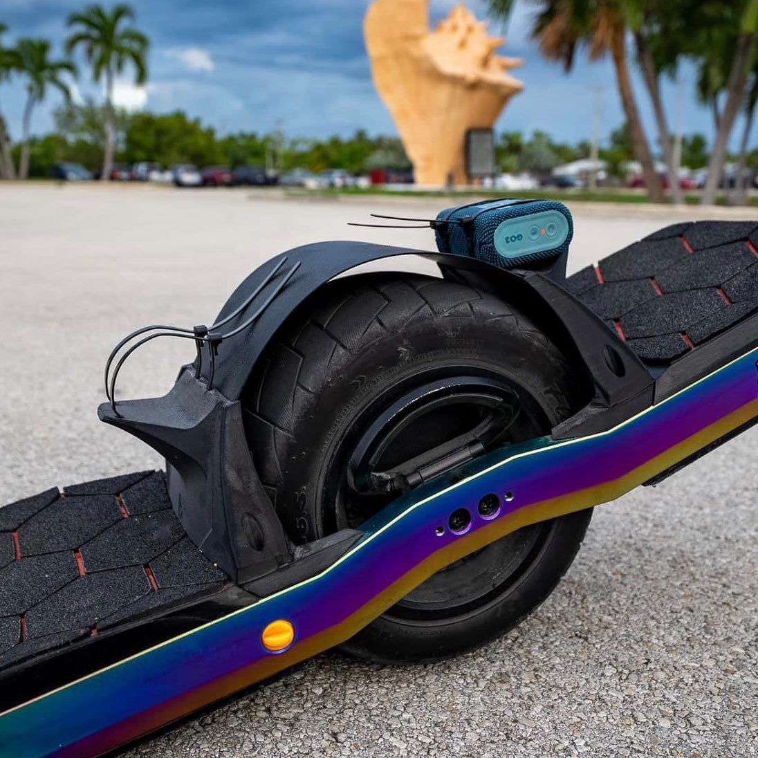 a onewheel board accessorized with wtf rails and RoadsterX fender with speaker mounted on